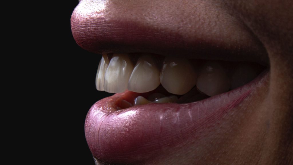 Periodontia 1 Perfil aproximado de um sorriso saudável com gengivas rosadas e dentes alinhados, destacando a saúde dos tecidos periodontais na Clínica Muglia.